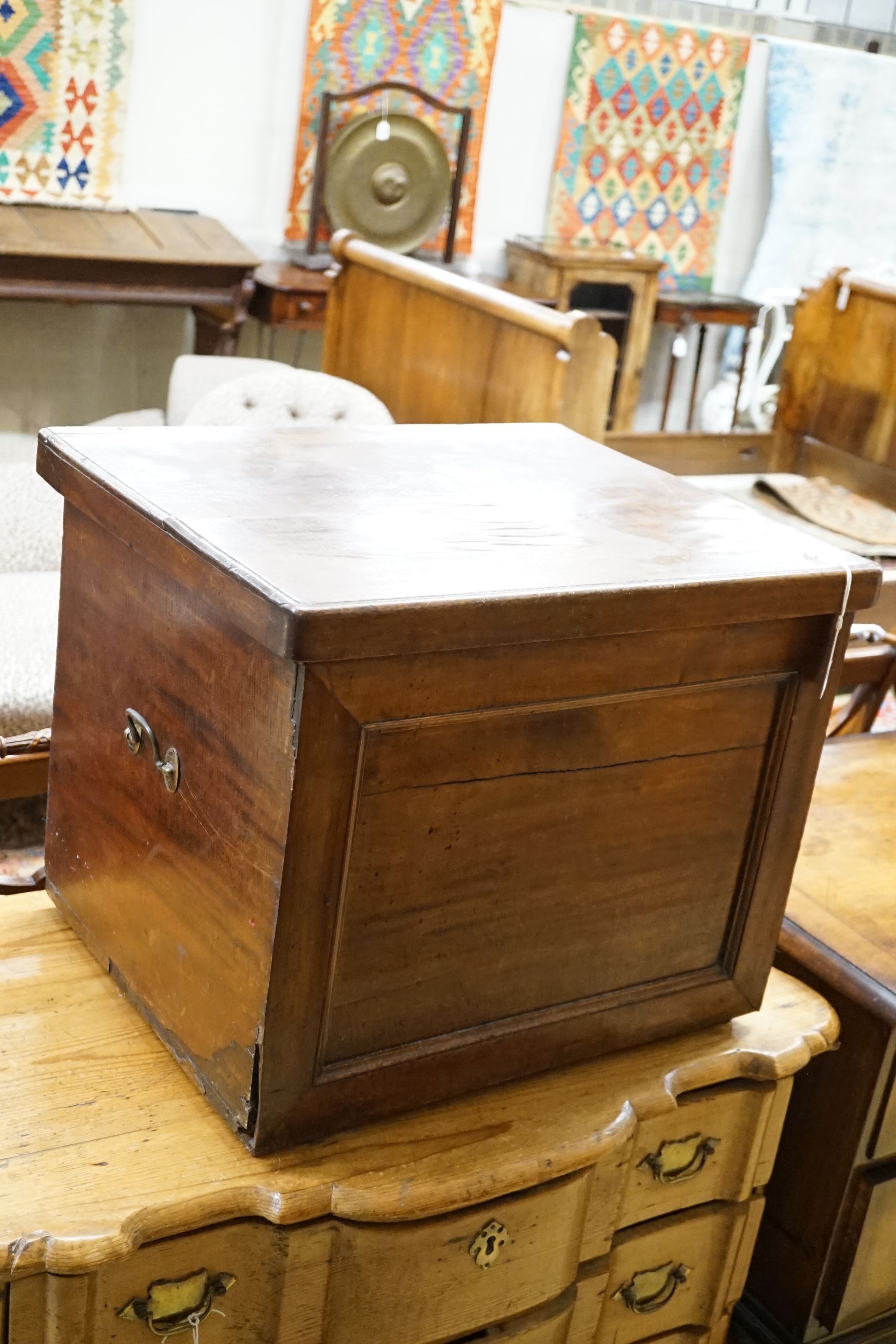 An early 19th century mahogany box commode with folding top and bone handled brass pump, width 57cm